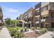 Modern community with courtyard, green space, and shaded seating areas at 6605 N 93Rd Ave # 1087, Glendale, AZ 85305