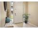 Bright entryway with tiled floor, bench, and potted plant at 6605 N 93Rd Ave # 1087, Glendale, AZ 85305