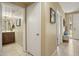 Bright hallway with tile flooring and access to a bathroom and other rooms at 6605 N 93Rd Ave # 1087, Glendale, AZ 85305