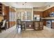 Spacious kitchen with an island, stainless steel appliances, and dark wood cabinets at 6605 N 93Rd Ave # 1087, Glendale, AZ 85305