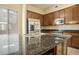 Modern kitchen with stainless steel appliances and granite countertops at 6605 N 93Rd Ave # 1087, Glendale, AZ 85305