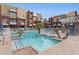 Community swimming pool with lounge chairs and a relaxing atmosphere at 6605 N 93Rd Ave # 1087, Glendale, AZ 85305