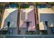 Bird's eye view of a single-Gathering home showcasing its tile roof, solar panels, and well-maintained landscaping at 6616 W Side Canyon Trl, Phoenix, AZ 85083