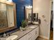 Beautiful bathroom featuring double sinks, modern fixtures, and stylish mirror at 6616 W Side Canyon Trl, Phoenix, AZ 85083