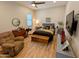 Comfortable bedroom featuring a ceiling fan, dresser, and lounger at 6616 W Side Canyon Trl, Phoenix, AZ 85083
