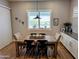 Bright dining room featuring a wooden table and modern decor at 6616 W Side Canyon Trl, Phoenix, AZ 85083