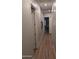 Bright hallway with hardwood floors and wall decor at 6616 W Side Canyon Trl, Phoenix, AZ 85083