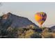 Hot air balloon over desert landscape at 6616 W Side Canyon Trl, Phoenix, AZ 85083