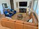 Spacious living room with comfortable seating, wood floors, and stylish decor at 6616 W Side Canyon Trl, Phoenix, AZ 85083