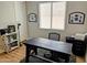 Bright home office with desk and a large window at 6616 W Side Canyon Trl, Phoenix, AZ 85083