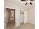 Bright bedroom with ceiling fan and spacious closet at 6657 E Regina St, Mesa, AZ 85215