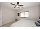 Bright bedroom with ceiling fan and window coverings at 6657 E Regina St, Mesa, AZ 85215