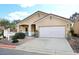 Charming single-story home featuring a two-car garage and low maintenance desert landscaping at 6657 E Regina St, Mesa, AZ 85215