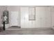 Garage with built-in storage cabinets and water heater at 6657 E Regina St, Mesa, AZ 85215