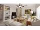 Inviting living room featuring built-in shelving, a ceiling fan, and cozy furniture at 6657 E Regina St, Mesa, AZ 85215