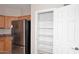 Well-organized pantry with ample shelving for storage at 6657 E Regina St, Mesa, AZ 85215