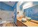 Updated bathroom with double vanity and a bathtub at 7833 S Terrace Rd, Tempe, AZ 85284