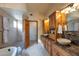 Elegant bathroom with double sinks, marble vanity, and shower at 7833 S Terrace Rd, Tempe, AZ 85284