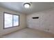 Bright bedroom with a large window and textured wall at 7833 S Terrace Rd, Tempe, AZ 85284