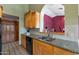 Kitchen with double sink, granite countertops, and light wood cabinets at 7833 S Terrace Rd, Tempe, AZ 85284