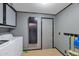 Bright laundry room with washer, dryer, and storage at 7833 S Terrace Rd, Tempe, AZ 85284