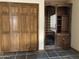 Home office with built-in shelving, wine rack and tile floors at 7833 S Terrace Rd, Tempe, AZ 85284