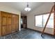 Home office with built-in shelving, wine rack and tile floors at 7833 S Terrace Rd, Tempe, AZ 85284