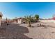 Sun-drenched backyard featuring gravel landscaping and a covered patio at 9714 E Indiana Ave, Sun Lakes, AZ 85248