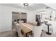 Dining area with wooden table and six upholstered chairs at 9714 E Indiana Ave, Sun Lakes, AZ 85248