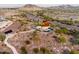 Aerial view of community amenities, including walking paths and a unique structure at 9781 S 182Nd Dr, Goodyear, AZ 85338