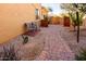 Landscaped side yard with brick pathway at 9781 S 182Nd Dr, Goodyear, AZ 85338