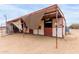 Exterior shot of a horse barn, providing shelter and stalls for livestock on the property at 35011 N 3Rd St, Phoenix, AZ 85086