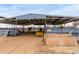 Open horse stall, partially covered with a yellow bench and stack of lumber at 35011 N 3Rd St, Phoenix, AZ 85086