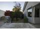 Landscaped backyard with built-in grill and mature plants at 10040 N 78Th Pl, Scottsdale, AZ 85258