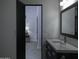 Bathroom with vanity, sink and view into bedroom at 10040 N 78Th Pl, Scottsdale, AZ 85258