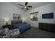 Bright bedroom with a ceiling fan, TV, and plenty of natural light at 10040 N 78Th Pl, Scottsdale, AZ 85258