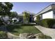 Beautiful front yard with artificial turf and landscaping at 10040 N 78Th Pl, Scottsdale, AZ 85258