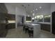 Modern kitchen with dark cabinetry, marble island, and high-end appliances at 10040 N 78Th Pl, Scottsdale, AZ 85258