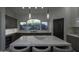 Modern kitchen with dark cabinetry, marble island, and high-end appliances at 10040 N 78Th Pl, Scottsdale, AZ 85258