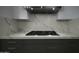 Modern kitchen with gas cooktop and marble countertops at 10040 N 78Th Pl, Scottsdale, AZ 85258