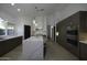 Modern kitchen with dark cabinetry, marble island, and high-end appliances at 10040 N 78Th Pl, Scottsdale, AZ 85258