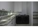 Laundry room with granite countertop and LG washer/dryer at 10040 N 78Th Pl, Scottsdale, AZ 85258