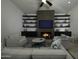 Open living room with a cozy fireplace and built-in shelving at 10040 N 78Th Pl, Scottsdale, AZ 85258