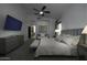Spacious main bedroom with a large TV and ensuite bathroom at 10040 N 78Th Pl, Scottsdale, AZ 85258