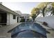 Inviting swimming pool and spa with a tiled border at 10040 N 78Th Pl, Scottsdale, AZ 85258