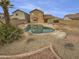 Relaxing backyard oasis with a kidney-shaped pool and desert landscaping at 12517 W Rosewood Dr, El Mirage, AZ 85335