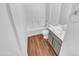 Clean bathroom with tub, vanity, and light wood-look flooring at 12517 W Rosewood Dr, El Mirage, AZ 85335
