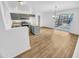 Modern kitchen with gray cabinets, stainless steel appliances, and an island at 12517 W Rosewood Dr, El Mirage, AZ 85335
