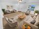 Bright living room featuring comfy sofas, armchairs, and a coffee table at 12517 W Rosewood Dr, El Mirage, AZ 85335