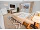 Large main bedroom with a king-size bed, dresser, and backyard view at 12517 W Rosewood Dr, El Mirage, AZ 85335